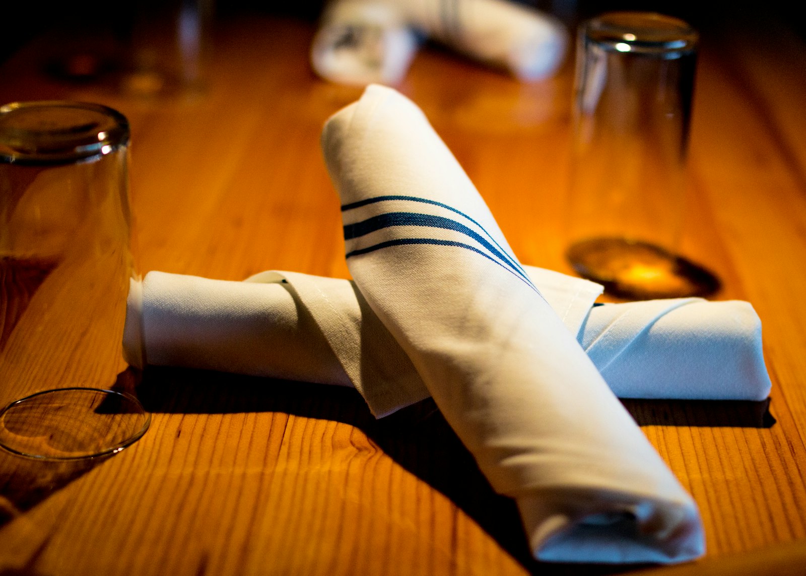 Rolled napkins on a restaurant table